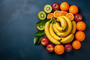 Top view different fruit composition bananas tangerines apples on dark-blue desk - obrazy, fototapety, plakaty