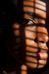 Extreme close up of a African american woman with striking eyes and pouty lips. Face of beautiful caucasian woman. interplay of light and shadow. Dramatic composition. High quality photo