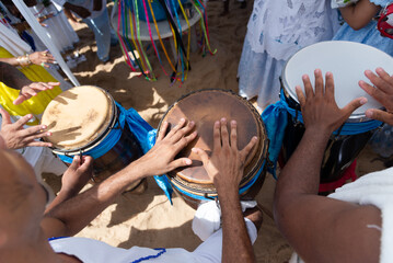 People are seen playing percussion instruments during a party for Iemanja on Rio Vermelho beach in...