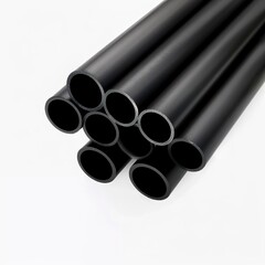 Fototapeta premium A set of robust black metal cylindrical tubes on a white background. Sophisticated and modern minimalist metallic tubes. Practical and functional metal tubes.