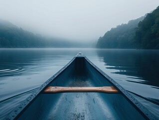 Serene canoe journey on a misty lake at dawn, emphasizing tranquility, adventure, and connection with water