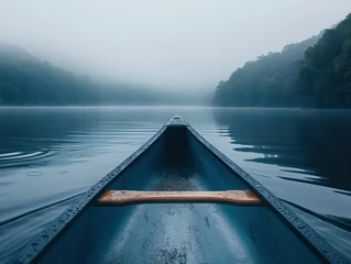 Foto op Canvas Serene canoe journey on a misty lake at dawn, emphasizing tranquility, adventure, and connection with water © Kanisorn