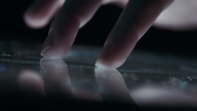 Person exploring a 3D map of a city on a tablet screen. Close up, slow motion. 