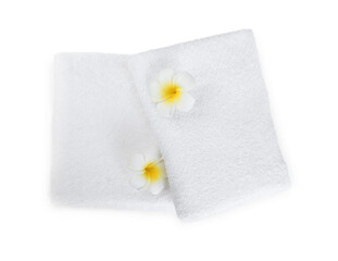 Terry towels and plumeria flowers isolated on white, top view