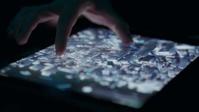 Person exploring 3D map of a city on a tablet touchscreen. Close up, slow motion. 