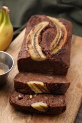 Delicious banana bread on wooden table, closeup