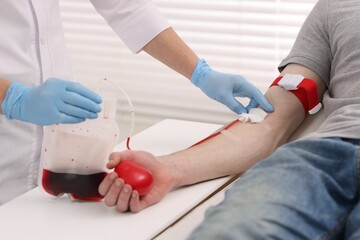 Patient undergoing blood transfusion in hospital, closeup