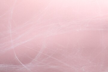 Creepy white cobweb hanging on pink background