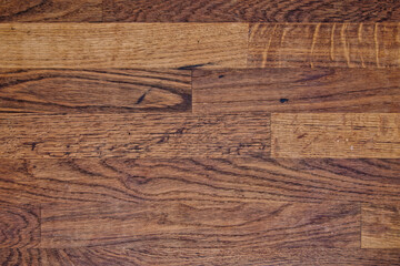 Seamless texture of a dark wooden surface with a distinct wood pattern.