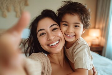 Smiling mother and son having fun as they take a playful and affectionate selfie at home - obrazy, fototapety, plakaty