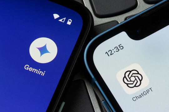 Portland, OR, USA - Feb 14, 2024: Google Gemini and OpenAI ChatGPT app icons are seen respectively on the screens of a Google Pixel smartphone and an iPhone. Gemini vs ChatGPT concept.