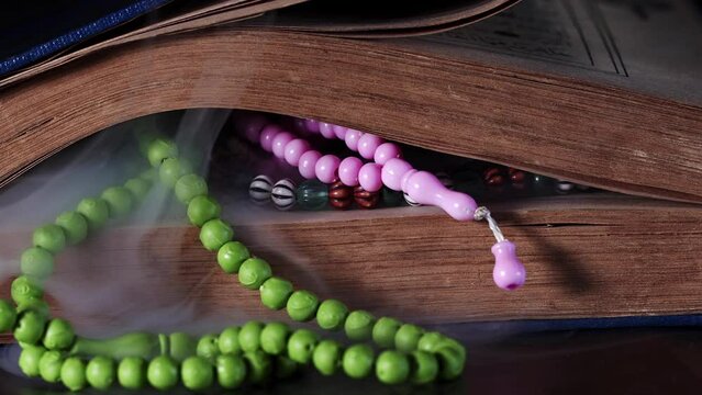 Religion The Book of Islam Quran and Rosary Beads
