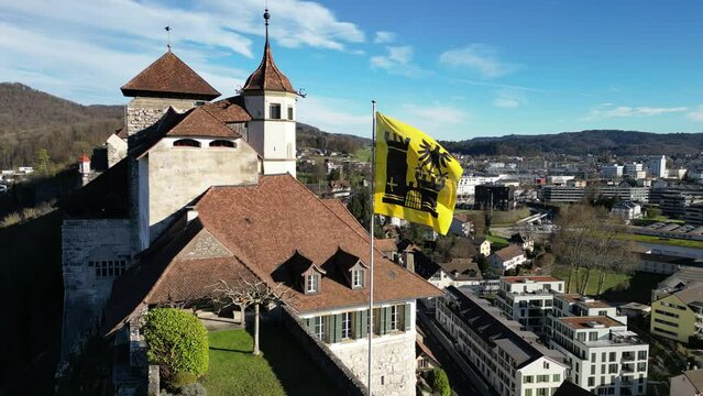 Aarburg Aargau Switzerland closeup of castle flag crest in the wind aerial
