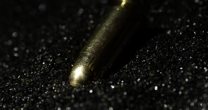 Smokeless Powder With A Pair Of 9mm Parabellum Bullets. Slow Motion, Close Up