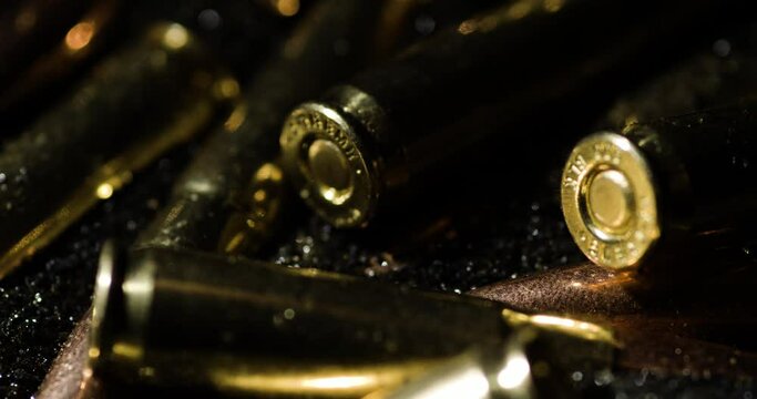 Macro detail of .300 AAC Blackout bullets sitting on gunpowder, circle pan
