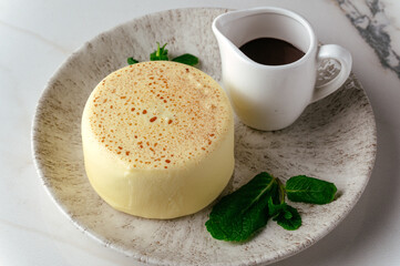 mousse dessert on a plate and coffee in a coffee shop on the tab