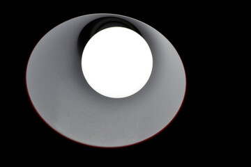 close up image of a bright light bulb in the dark idea concept showing 