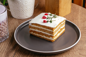 sponge cake dessert on a plate in a coffee shop on the table