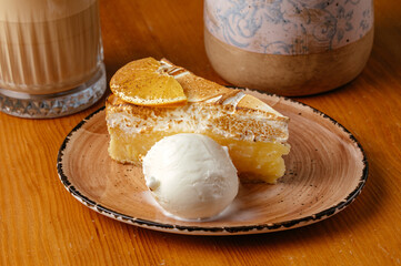 cheesecake on a plate on the table in a coffee shop.