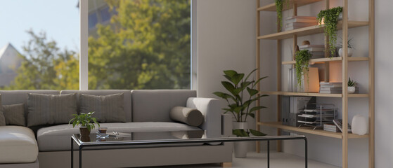 The interior design of a modern living room features a cozy grey couch and a modern coffee table.