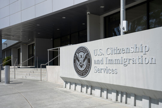 Santa Clara, CA, USA - Apr 30, 2022: U.S. Citizenship and Immigration Services (USCIS) sign is seen at the entrance to the USCIS San Jose Field Office in Santa Clara, California.