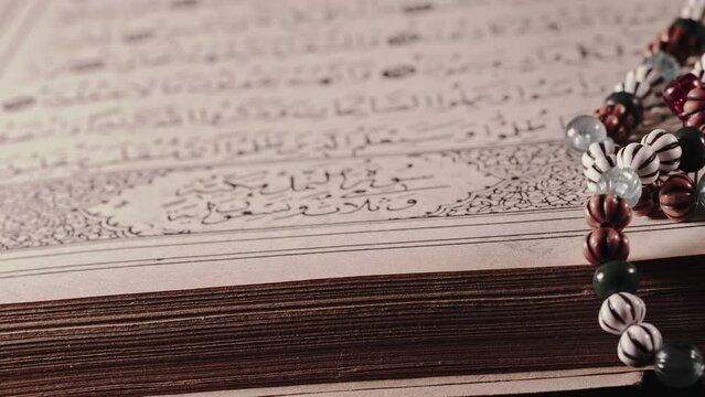 Religion The Book of Islam Quran and Rosary Beads