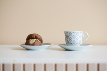 chocolate sweet cookies and black coffee on a serving table 