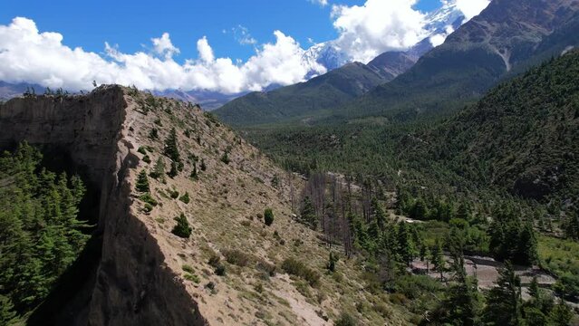 Flying over Steep Cliffy Mountain Crest Near Jomsom, Nepal - Aerial picturesque wilderness