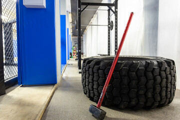Close-up of a weight training gym with a huge wheel and hammer