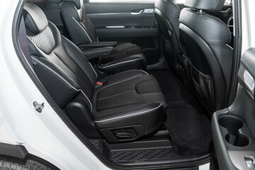 Black leather interior design, car passenger and driver seats with seats belt.