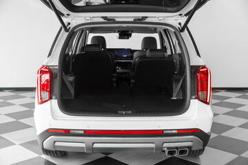 Clean, open empty trunk in the white  car SUV in parking © Виталий Сова