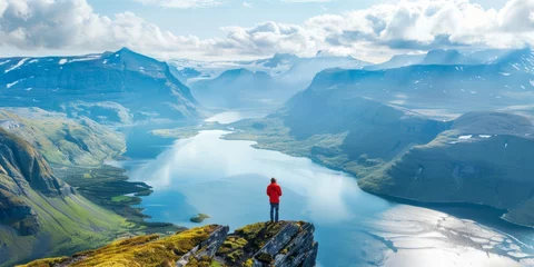 Tuinposter Travel Adventures: Exciting image of a person exploring a breathtaking mountain landscape, inspiring wanderlust © CYBERUSS