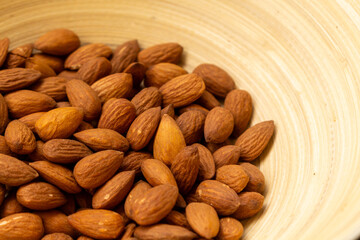 Almonds in a bamboo bowl.