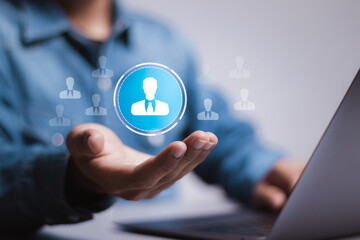 Human resources, CRM. Person use laptop with HR icon on virtual screen for Search for employees and looking for talent. team building.