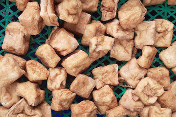 Fried tofu, a snack or cooking ingredient, ingredients from fried tofu, come in triangular and rectangular shapes