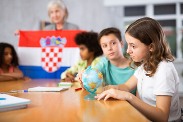 Kids learning together about croatia in geography class