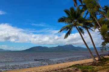 Looking towards Hinchinbrook Island, Queensland: Azure waters frame the lush greenery of this tropical paradise, inviting exploration and relaxation.