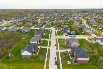 Fototapeta premium Aerial top down view of houses in a neighborhood, Michigan