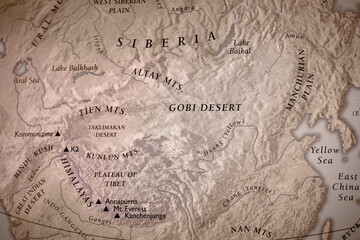 Traditional geographical map of Himalayan mountain range and Gobi desert in Tibet and China.