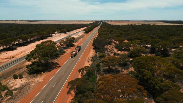road train driving on an highway in the australian outback in western australia