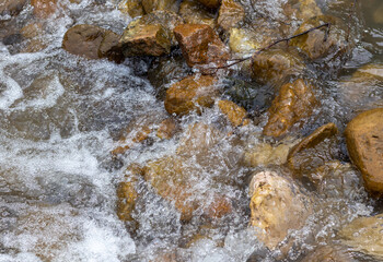 Mountain river spring season with sand and stone shoals along the banks.