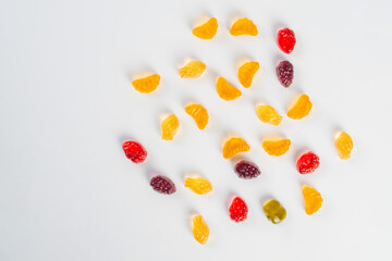 Fruit gummi candies assortment on white background 