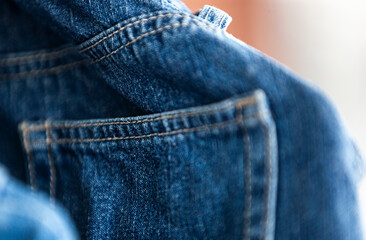 Close up of blue jeans pocket.