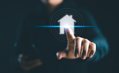 Business, technology, internet and networking concept - businessman pressing real estate button on virtual screens..