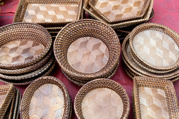 View of the bowls and plates made of bamboo displayed in the market of Luang Prabang, Laos