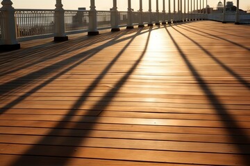 Sunlight casting long shadows on a boardwalk