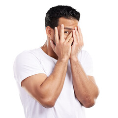 Peek, fingers and man with fear or scared, danger and caution with hands covering face isolated on...