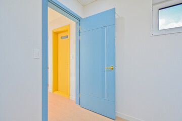 The bright sky blue color of the door stimulates children’s innocence