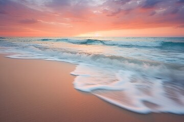 Gentle waves washing ashore during a tranquil sunrise