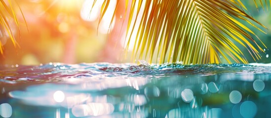 Obraz premium The electric blue water of the swimming pool reflects a palm tree, creating a stunning natural landscape art piece with a serene pattern and grass surroundings